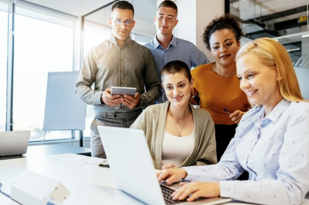 Businesswomen working in team in modern corporate office Group of young and mid-adult business people working in office